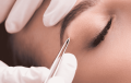 Eyebrow shaping with tweezers