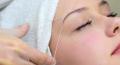 Shaping eyebrows with thread/wax